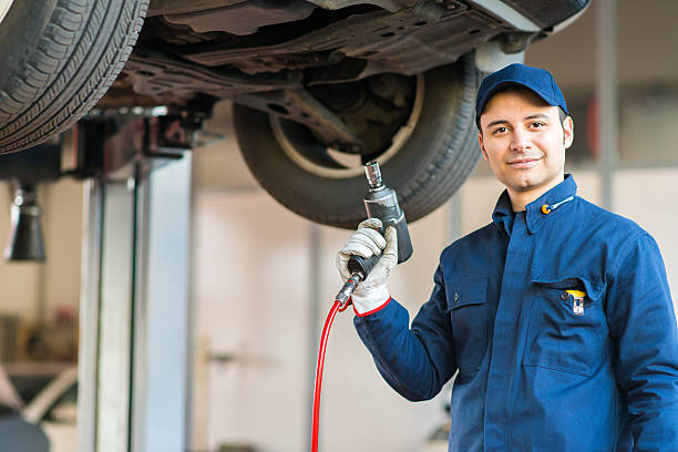istock Portrait of a mechanic replacing wheel 504070194