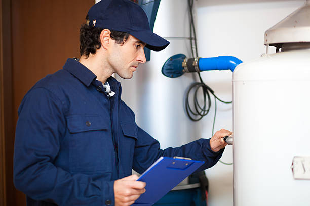 istock Technician repairing an hot-water heater 504070232