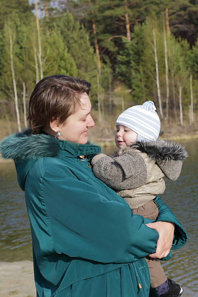 istock Mother holding her child 504070646