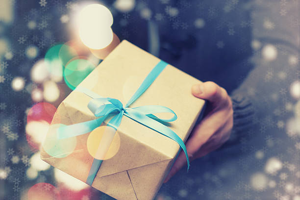 istock gift giving hand christmas 504071942