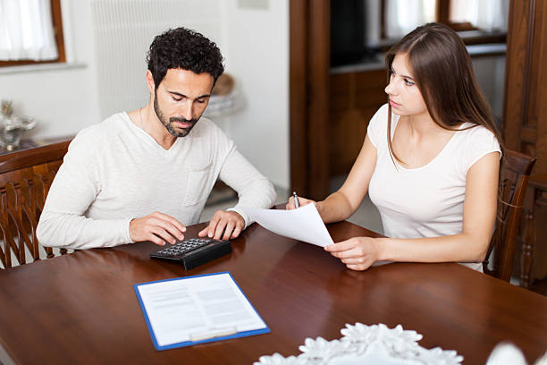 istock Young couple calculating their expenses 504072614