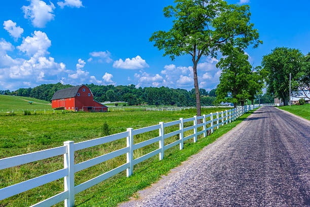 istock Midwest farm  with country road and red barn (P) 504074306
