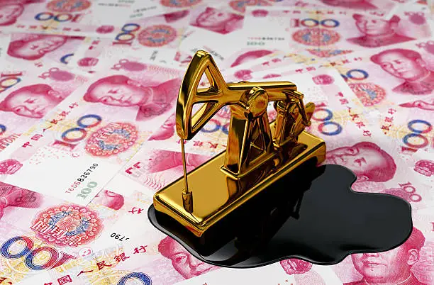 Photo of Golden Pumpjack And Spilled Oil On Yuan