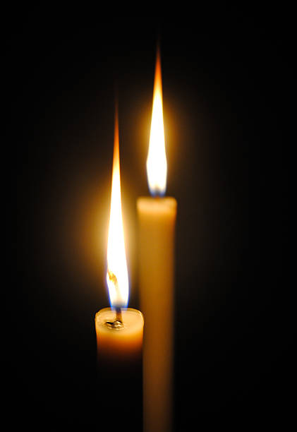 istock Two candles in the dark. 504077086