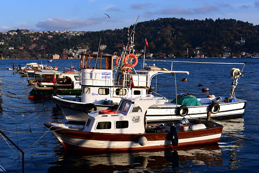 Istanbul, Turkey - December 19, 2015: Fishing boats are anchored on the bosphorus. 