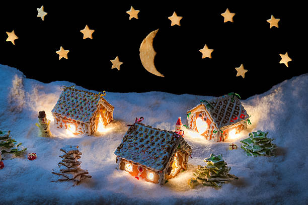 istock Gingerbread lodge with light from the window in winter 504078141
