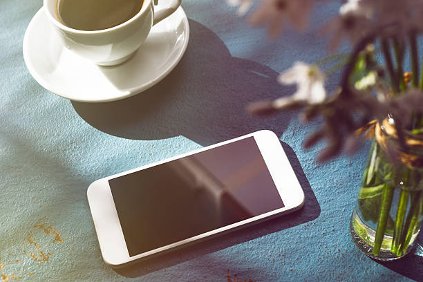 istock Coffee Cup on Table and Mobile Phone 504079818