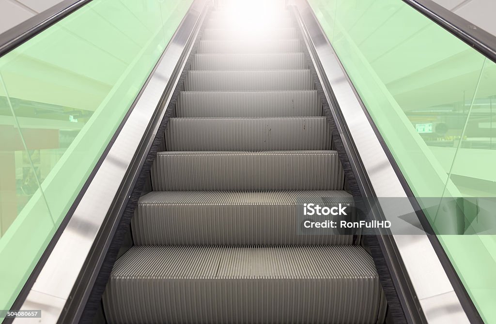 escalator Escalator with green glass. Abstract Stock Photo