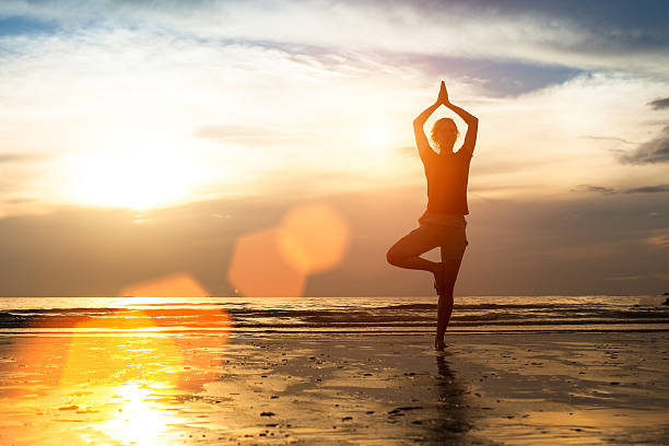 istock Woman exercise on the beach at sunset. 504080711