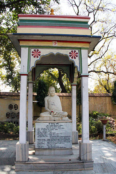 Sarnath, India - March 14, 2011: A statue at the Sridigamber Jain Temple in honour of the birthplace of Shreyansanath, the eleventh Tirthankara of Jainism. This important pilgrimage site is located by the Dhamekh Stupa, where Buddha gave his first sermon.