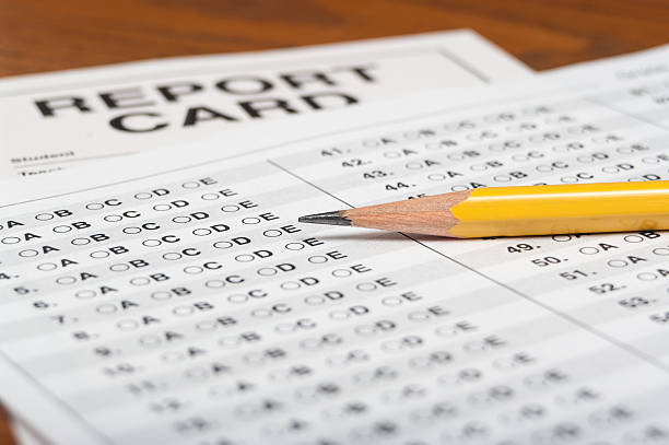 Standardized test with pencil and report card stock photo