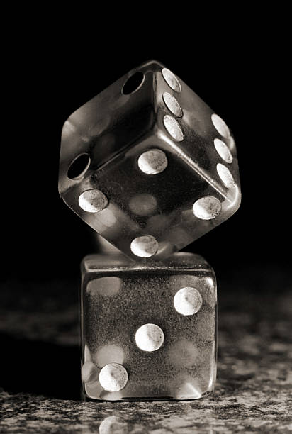 istock One The Balancing on Aonther Die. 504084059