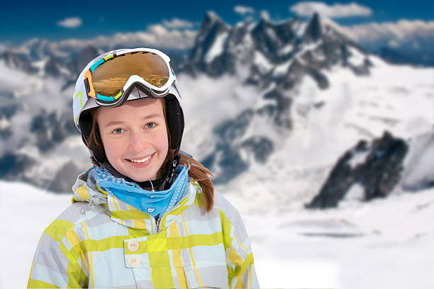 istock Young woman smiling at a ski resort 504085576