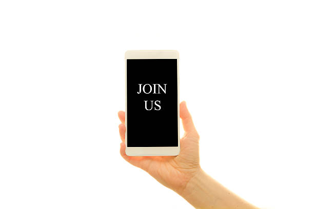 istock Woman holding generic phone with the Join Us 504085722