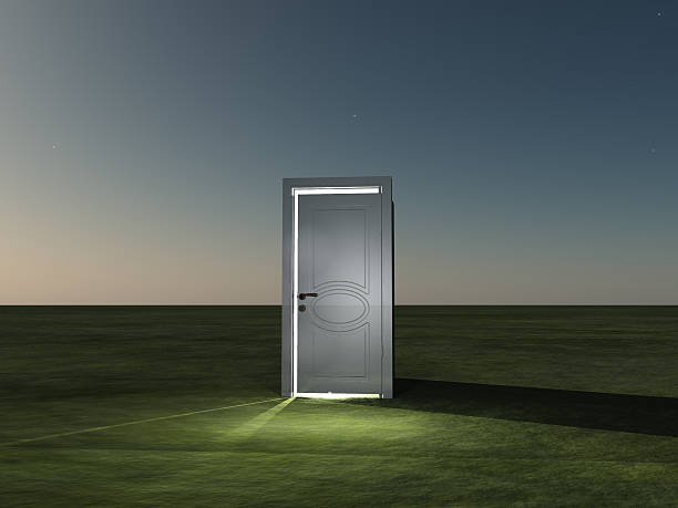 istock Partly closed door emits light 504086118