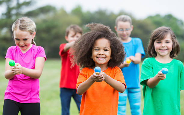 istock Multiracial group of children in an egg spoon race 504086590