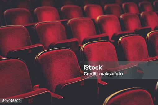 istock Empty comfortable red seats with numbers in cinema 504096800