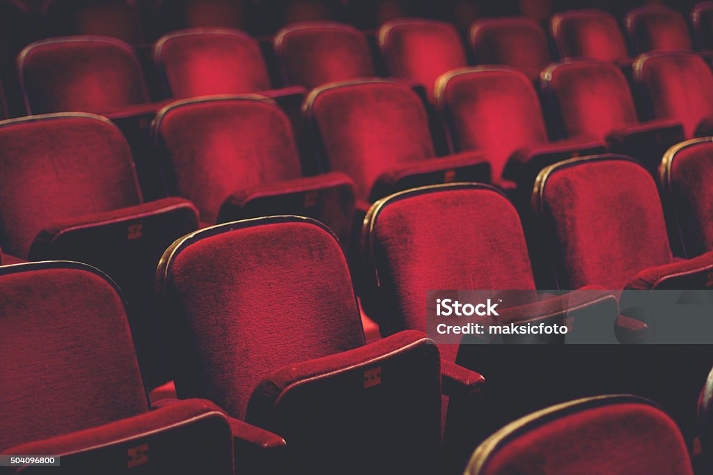 Empty comfortable red seats with numbers in cinema Movie Theater Stock Photo