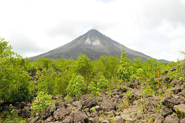 Arenal Volcano with volcanic rocks in the foreground, Costa Rica