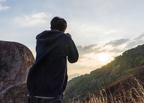 istock Man taking photo on the mountain when sunset 504099008