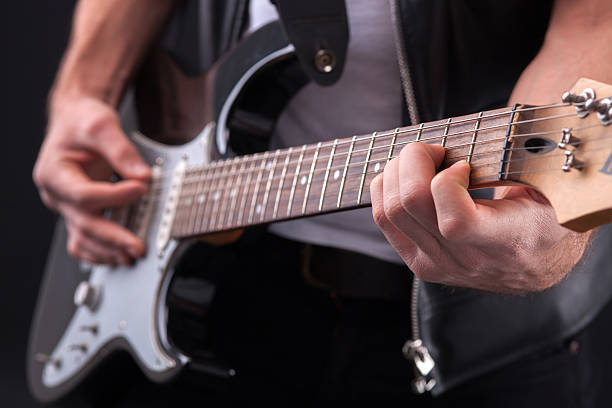 istock Cheerful male musician is performing on musical instrument 504100708