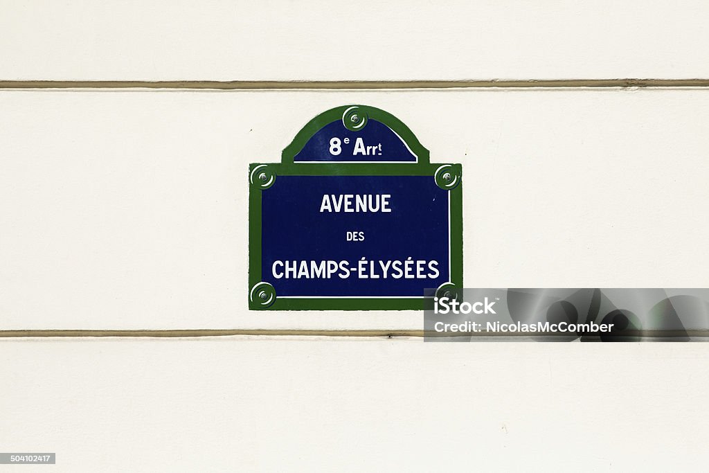 Avenue des champs-elysees street sign Avenue des champs-elysees street sign on beige wall. Street Name Sign Stock Photo