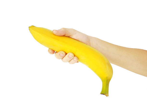 istock Ripe banana in hand boy, isolated 504102872