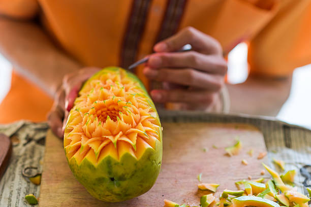 Fruit Carving Fruit carving art of Thailand for punctilious food carving fruit stock pictures, royalty-free photos & images