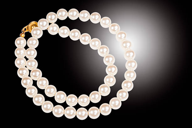 istock Pearl necklace isolated on black 504103478
