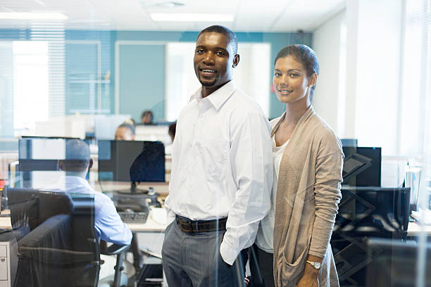 istock African business partners smiling, looking at the camera. 504103615