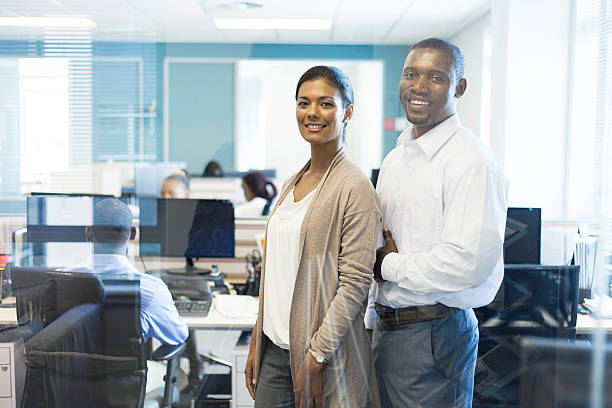 istock African business partners smiling, looking at the camera. 504103617