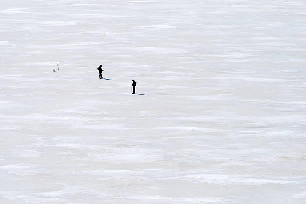 istock two fisherman on ice 504103933