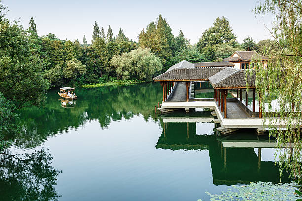 istock ancient traditional gallery bridge in hangzhou west lake,China 504104708