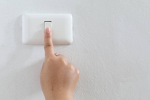istock closeup finger press turn on/off electric-switch 504105081