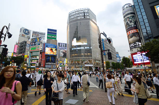 City life in Tokyo, people crossing in the Shibuya area, one of Tokyo busiest.