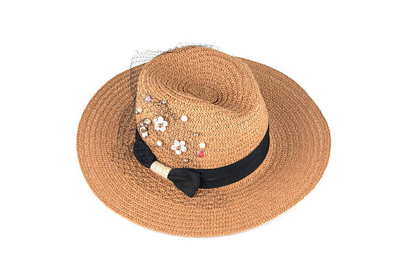 istock Pretty straw hat with flower isolated on white 504105800