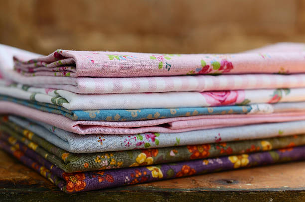 istock Pile of floral pattern textile in shabby chic style 504106023