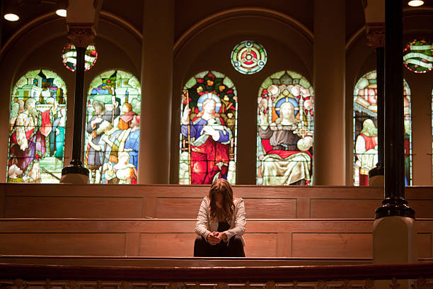 istock Young woman Praying 504106276