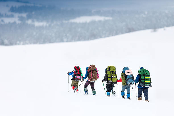 istock hiking in winter mountains 504106519