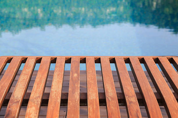 istock Wood floor near swimming pool 504107512