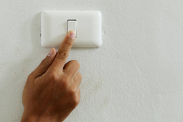 istock closeup finger press turn on/off electric-switch 504108495