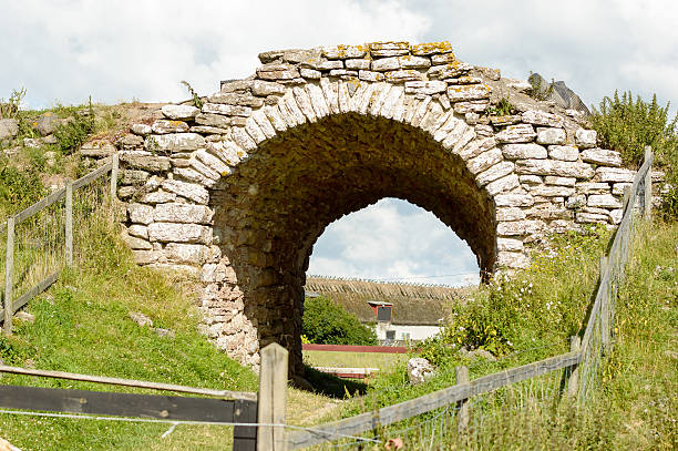 Entrance to Graborg Stone arch at the entrance to Graborg ruin. bailey castle photos stock pictures, royalty-free photos & images