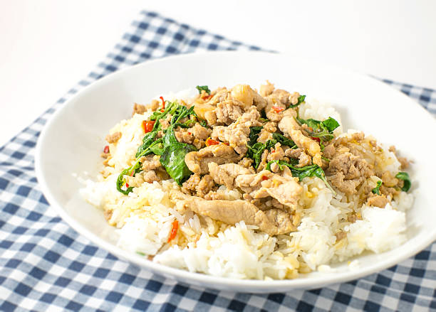 istock stir fried pork basil and rice on blue tablecloth 504108530