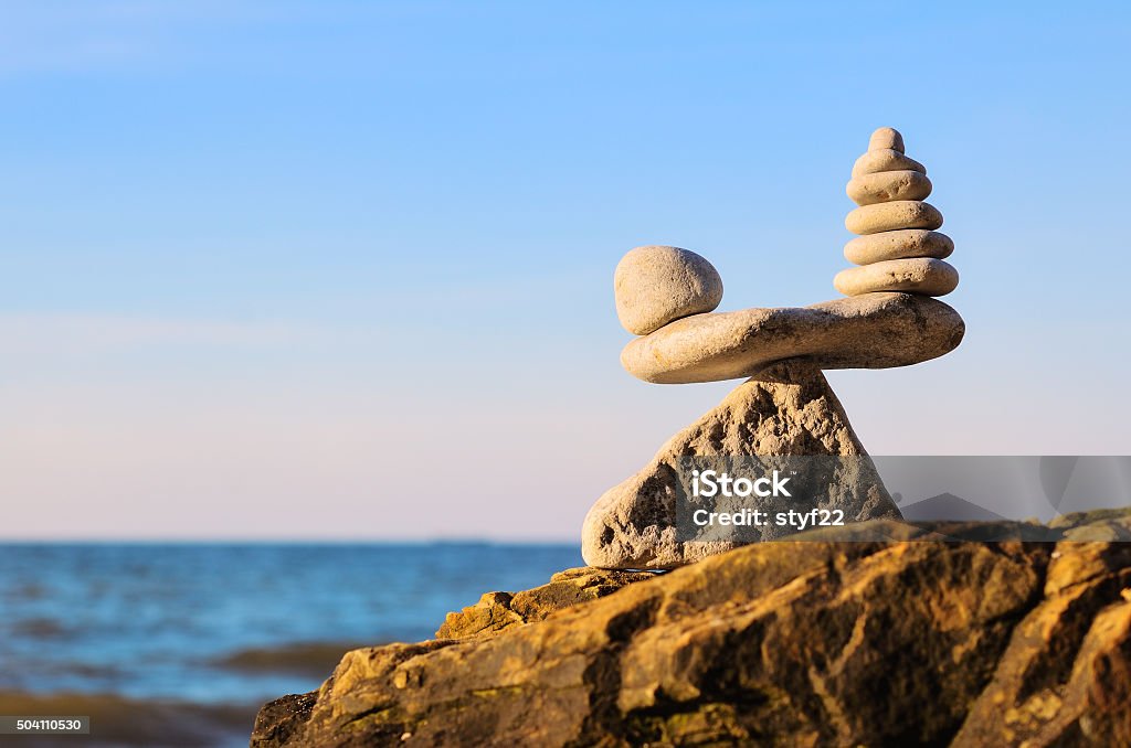 Zen stones in balance Stack of zen stones in balance at seashore Balance Stock Photo