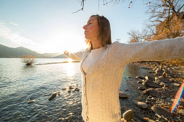 istock Cheering woman at sunrise 504111366