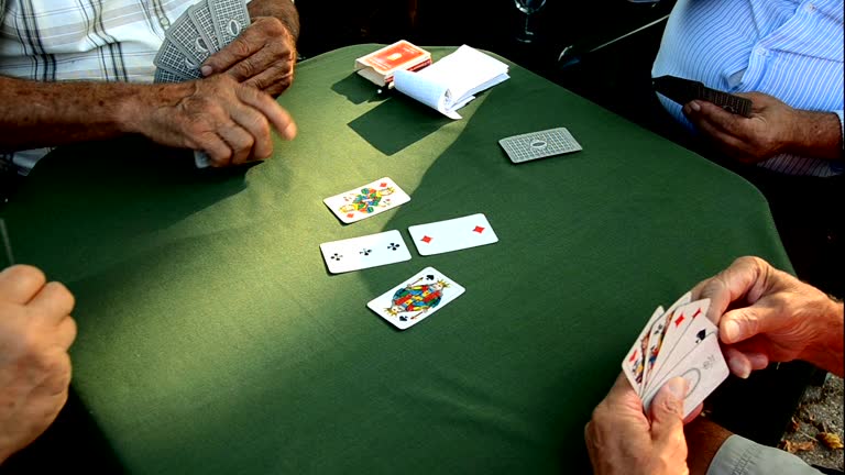Seniors playing Scopa, Italian card game