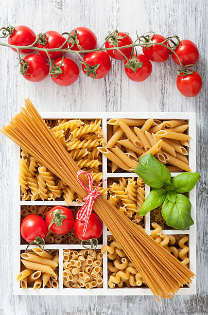 istock various raw wholegrain pasta in white wooden box 504120936