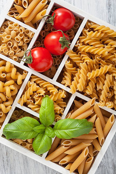 istock various raw wholegrain pasta in white wooden box 504120982