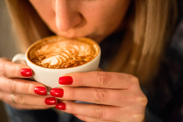 istock Pretty young woman drinking coffee 504121668