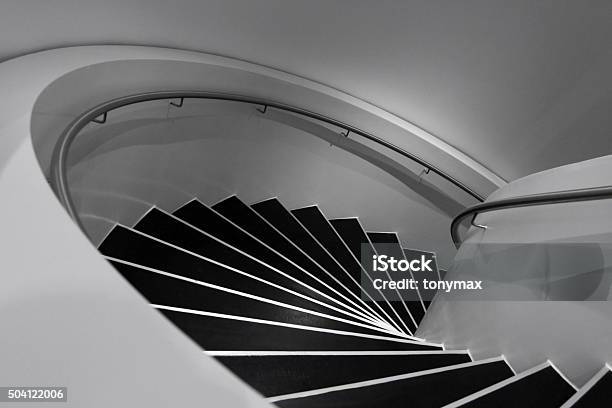 Black And White Photo Of Spiral Staircase In Minimalism Style Stock Photo - Download Image Now